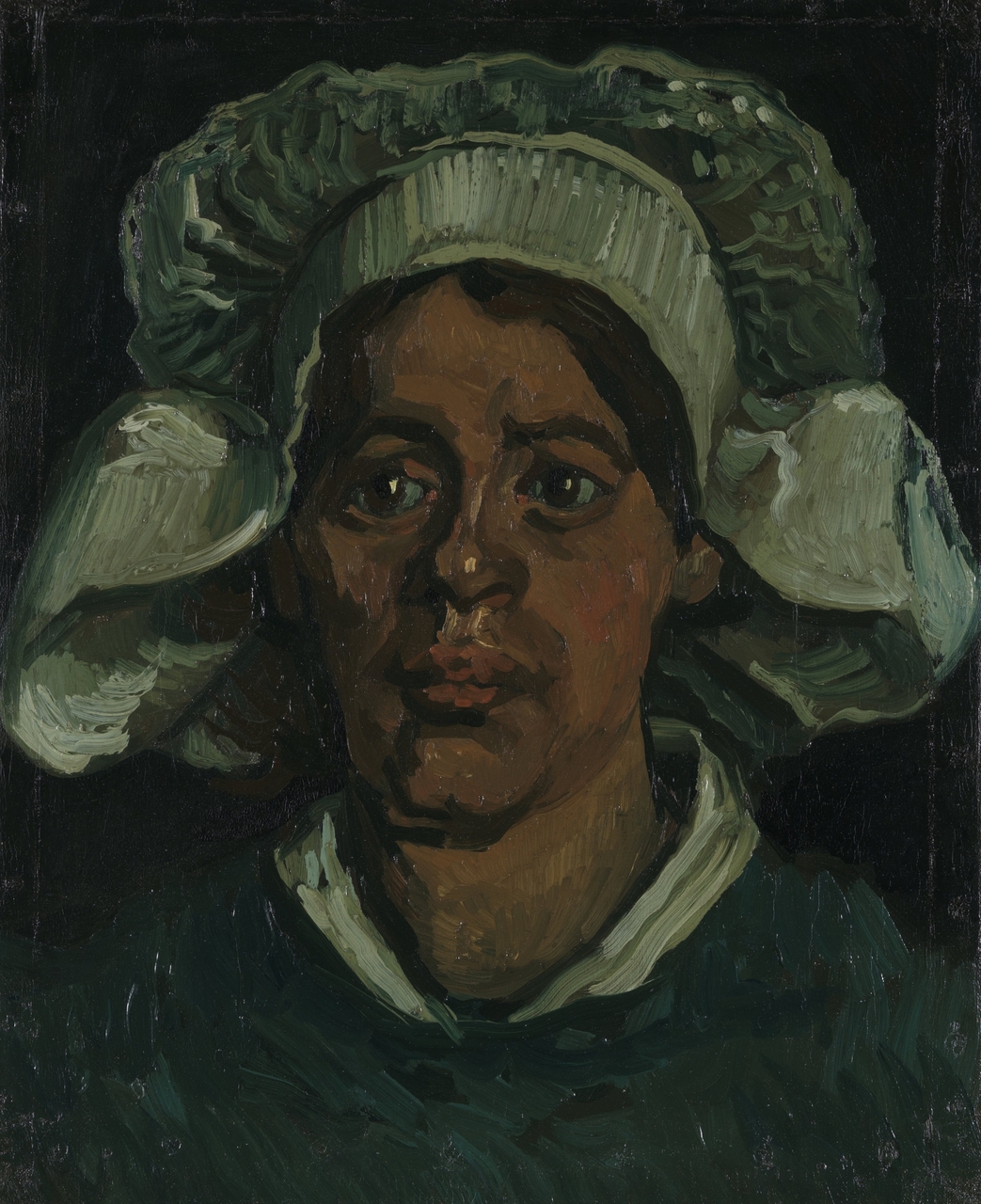 Head of a woman wearing a white cap